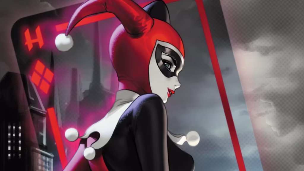 harley quinn 40 cover art featuring hq in her classic costume with a playing card as the backdrop.jp