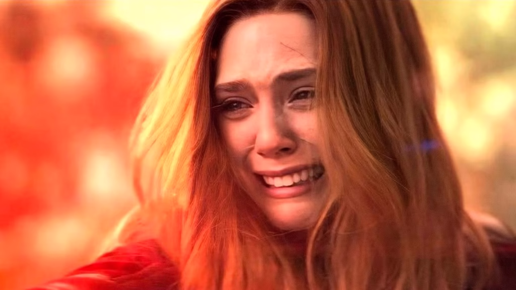 elizabeth olsen s wanda maximoff aka scarlet witch cries while using chaos magic in avengers infinit