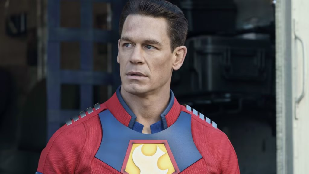 john cena as peacemaker looking to the side with a slight look of curiosity on his face in peacemake