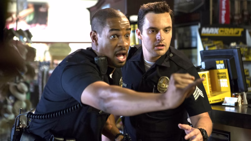 damon wayans justin holding his pinky out for a pinky promise while jake johnson s ryan looks in sho